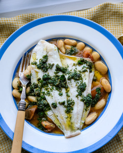 Cornish plaice with butter beans, winter tomatoes, and caper salsa